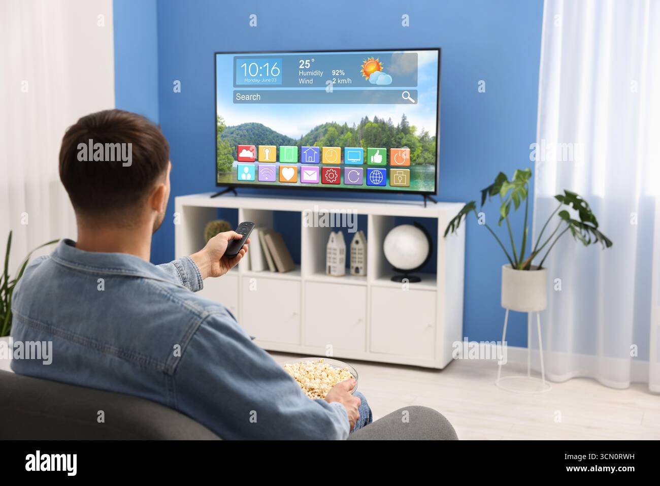 Person watching weather show hi-res stock photography and images - Alamy