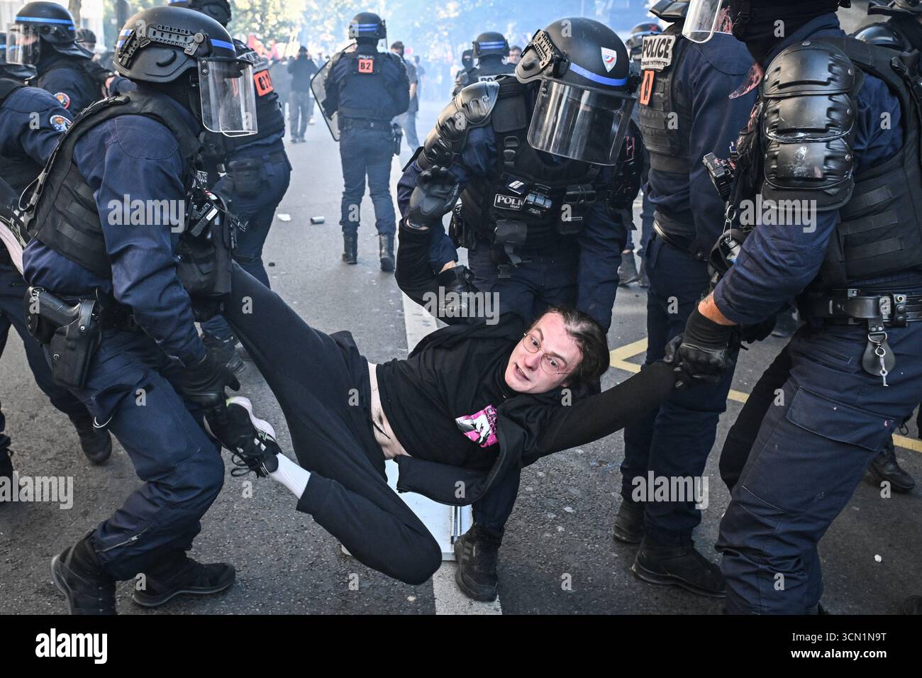 Clashes occur between French riot police and protesters during a ...