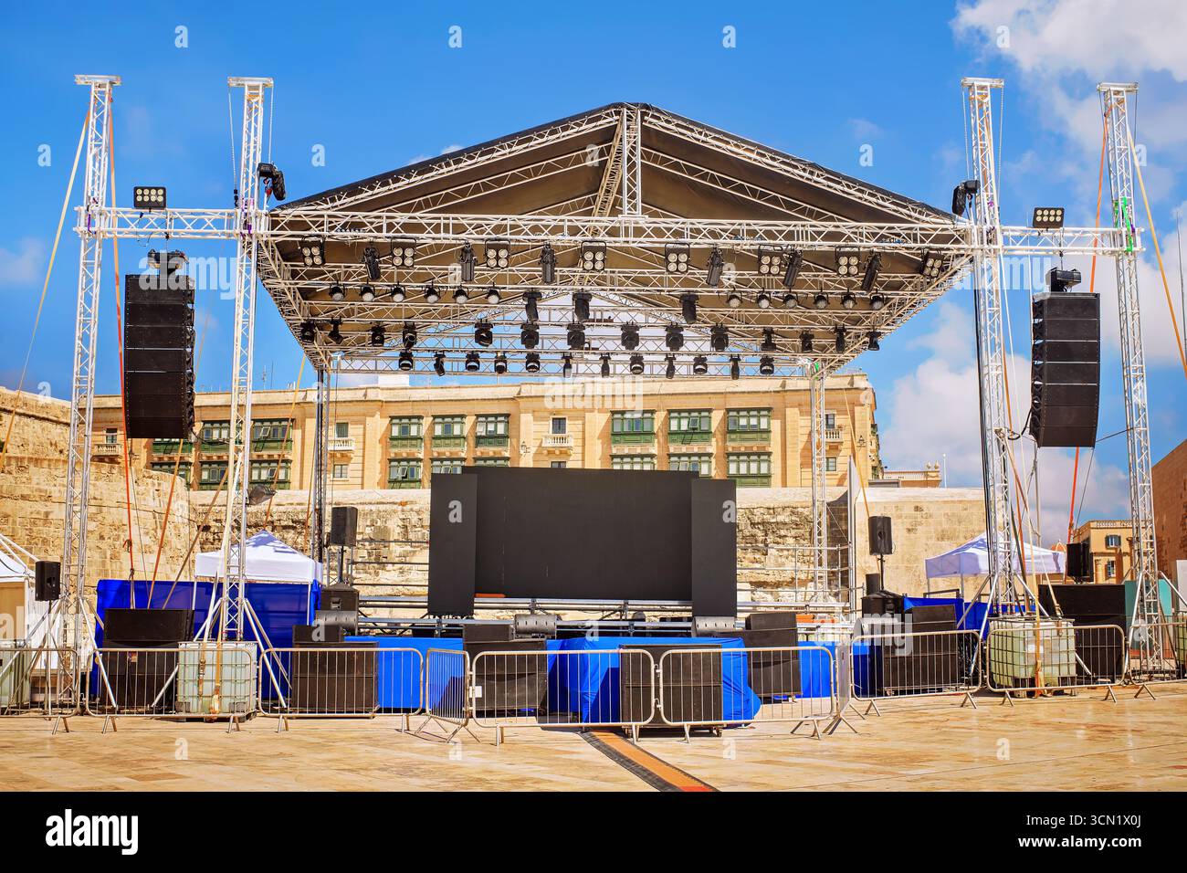 Large outdoor concert stage with truss, LED lights, speakers, and ...