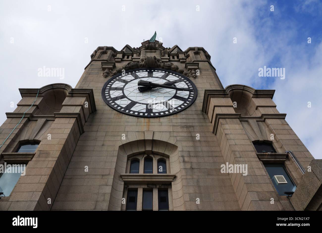 A low-angle close-up of the famous clock face on Liverpool's iconic ...