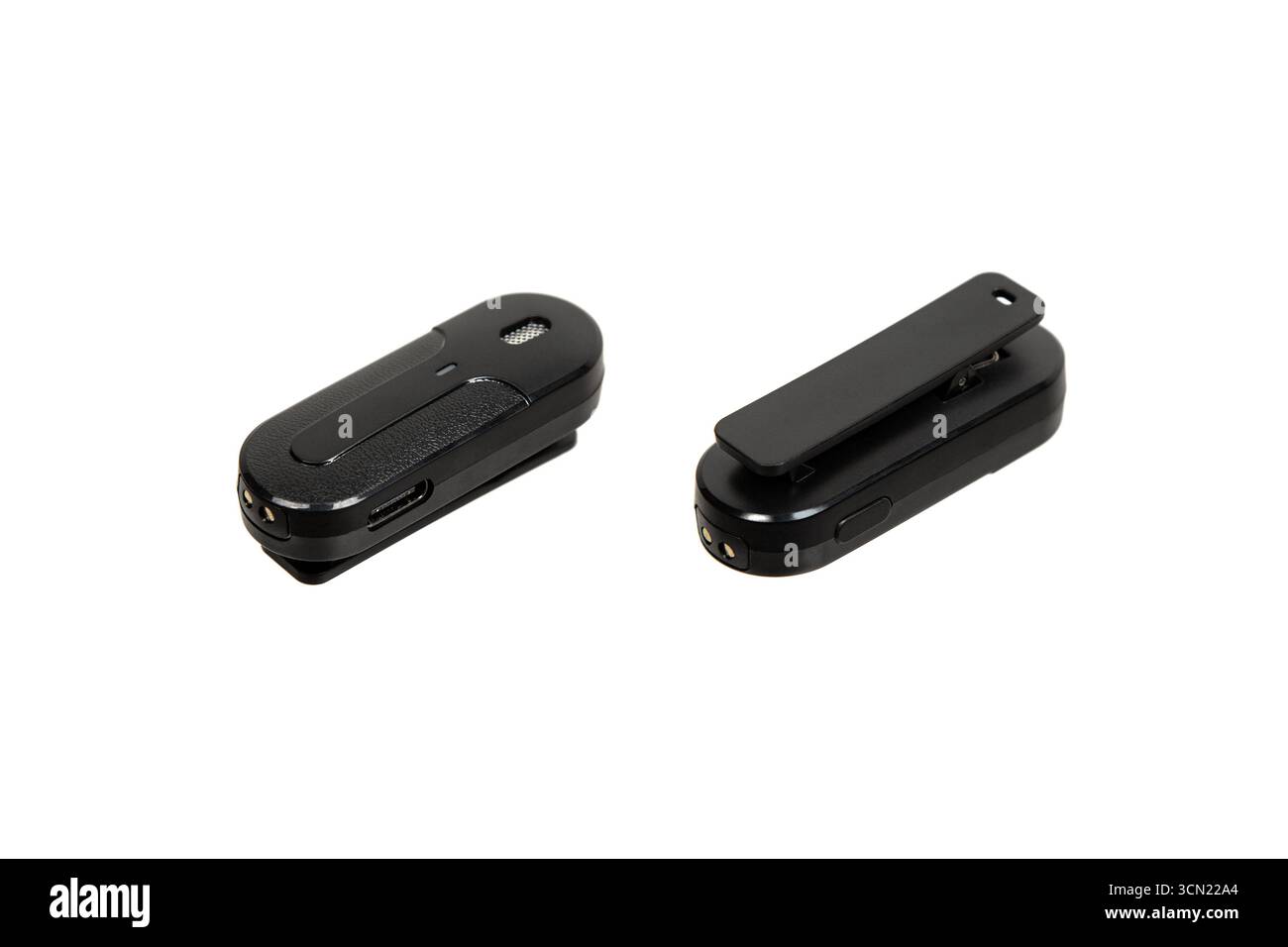 Two black wireless microphones shown from different angles. Stock Photo