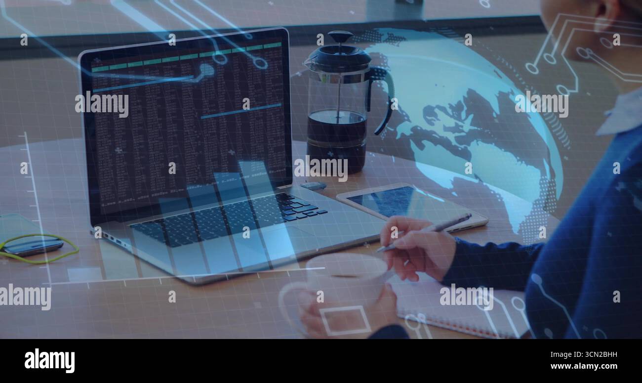 Stirring mug female coder in sweater writing code notes at workspace, with laptop, copy space. Technology, digital, workspace, productivity, modern, i Stock Photo