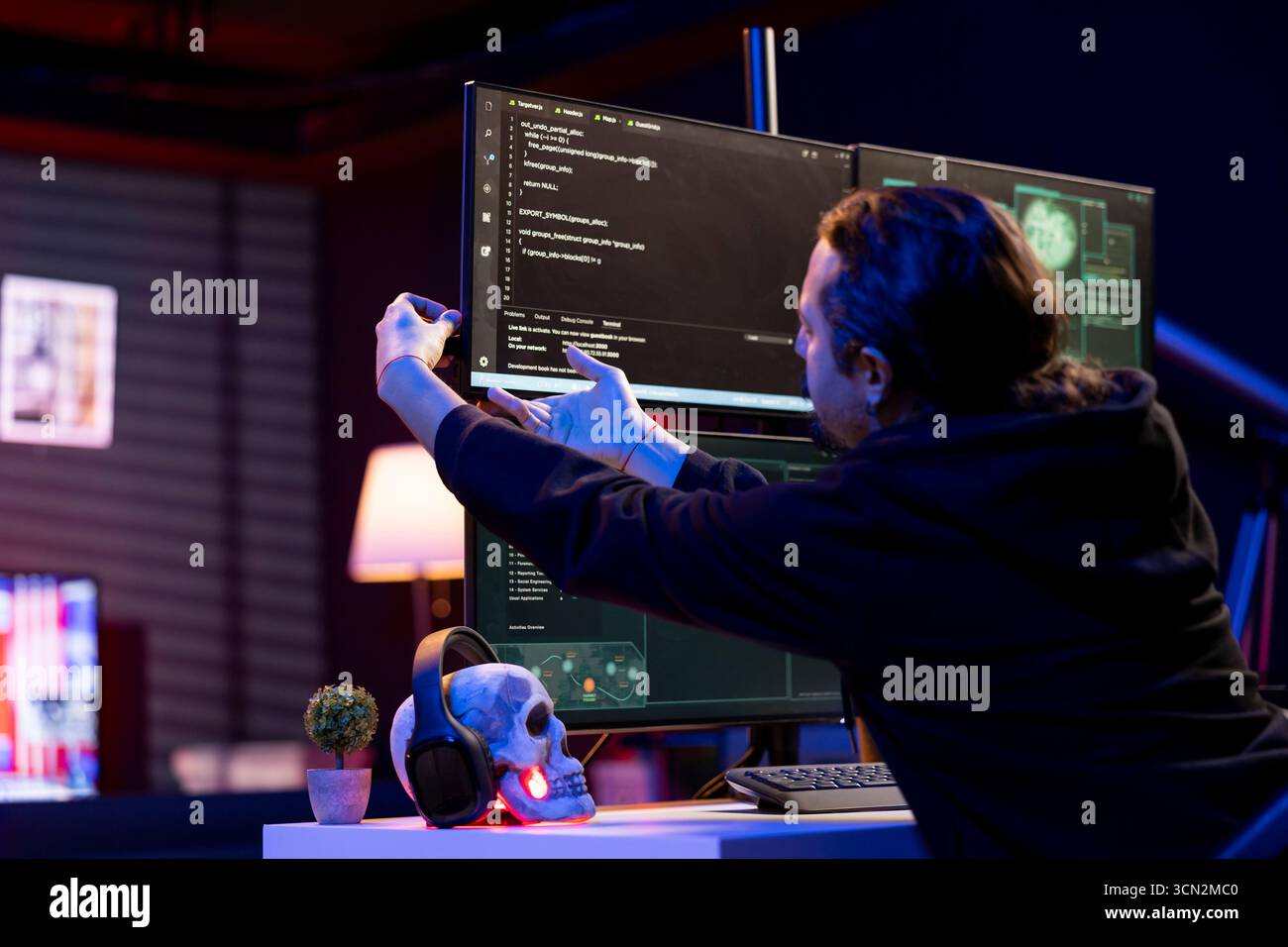 Cybercriminal inserting USB stick in PC with stealth malware that evades security software. Hacker uploading flash drive with script hiding malicious code from detection systems Stock Photo