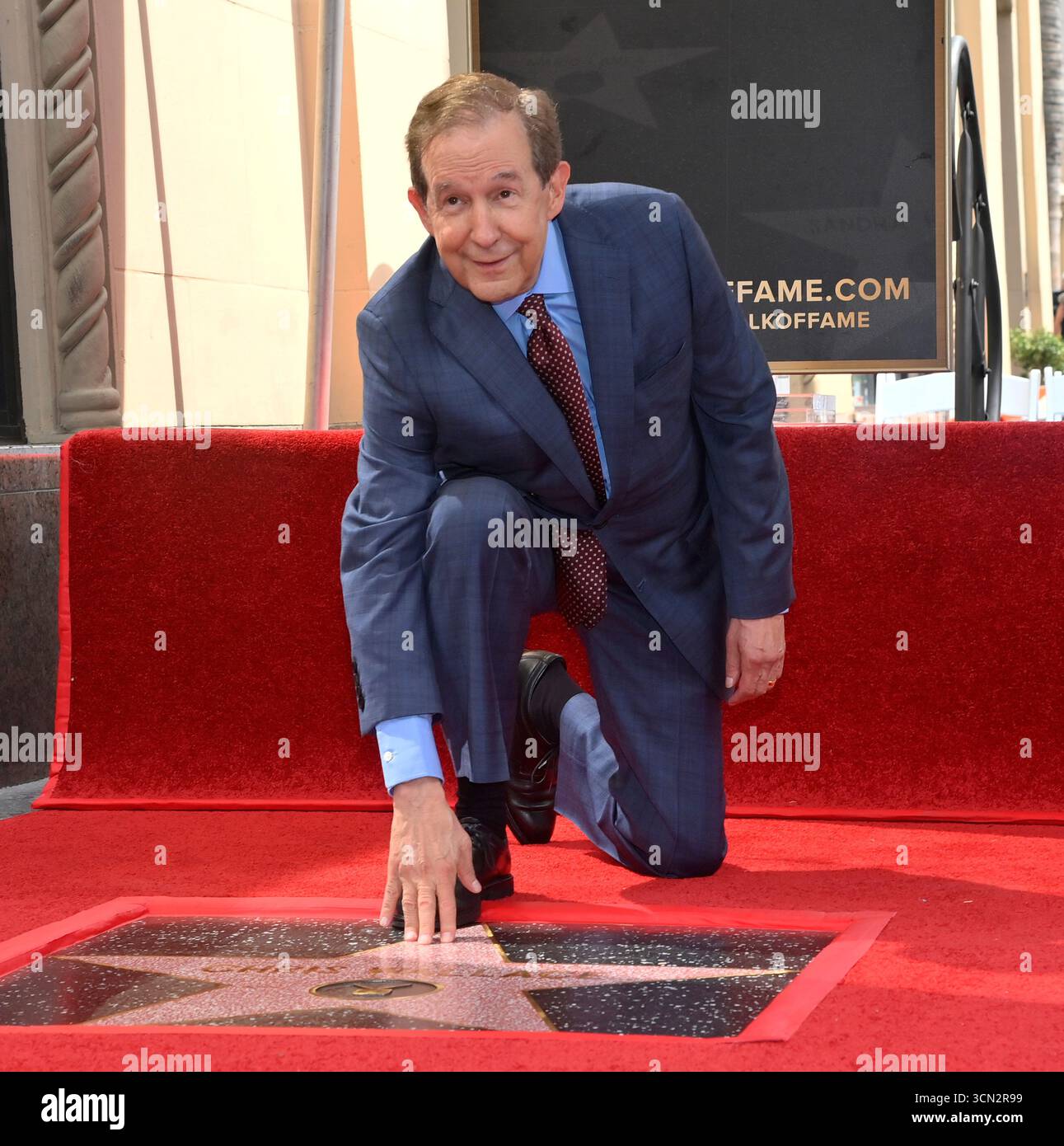 US journalist Chris Wallace touches his star during an unveiling ...