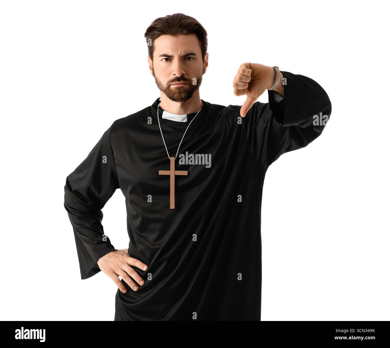 Upset priest showing thumb-down on white background Stock Photo