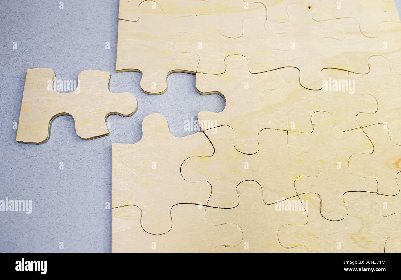 solving the problem concept - puzzles and cogwheels. wooden gears under ...