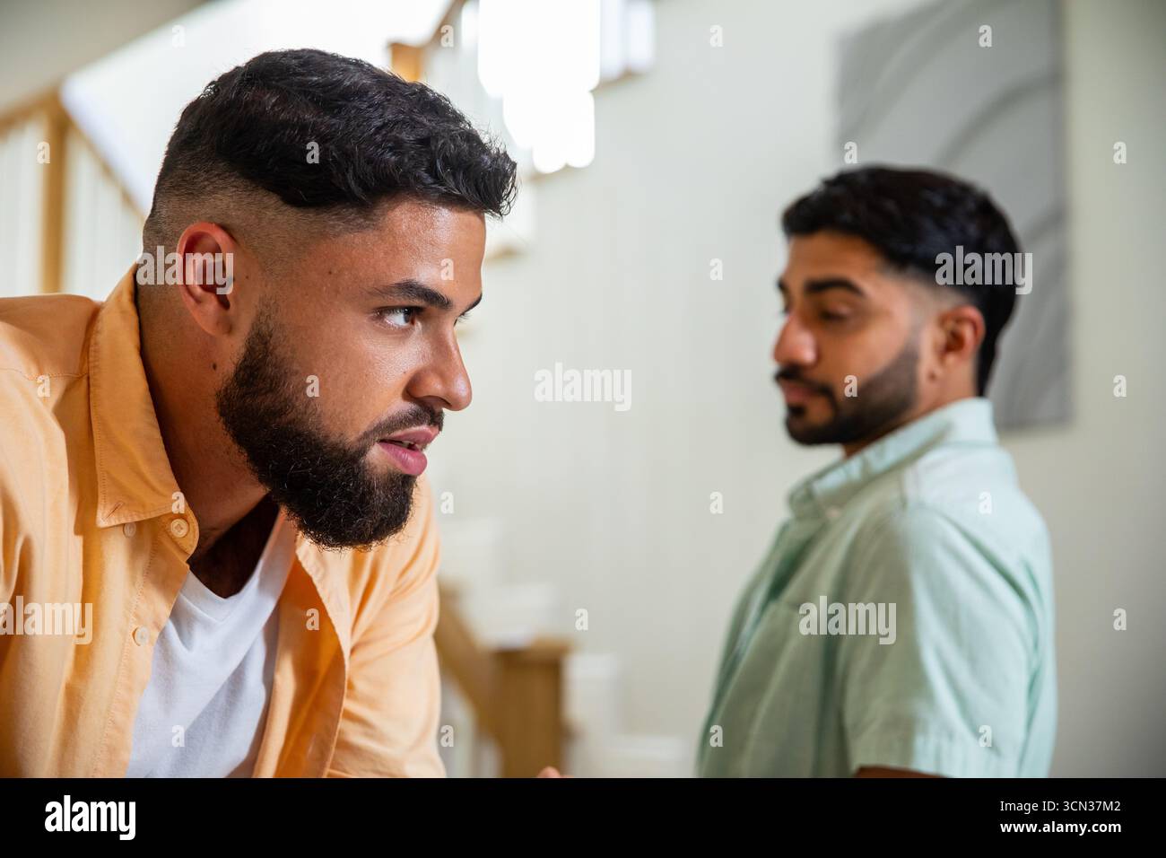 Diverse male friends meeting wall hi-res stock photography and images ...