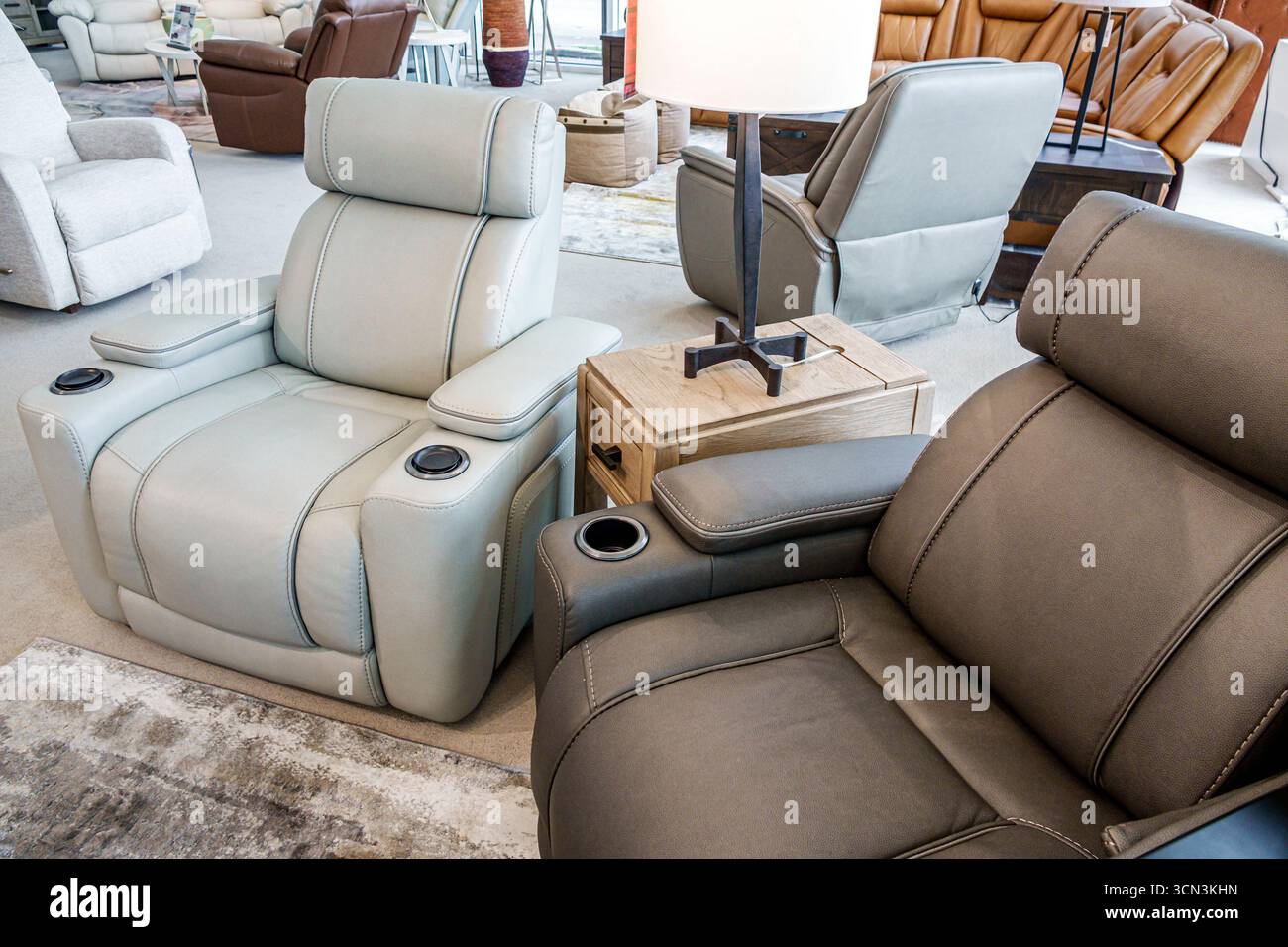 Kendall Miami Florida,Rooms to Go,furniture store business,inside interior,display sale staging,side by side recliners,gray and brown leather chairs,m Stock Photo