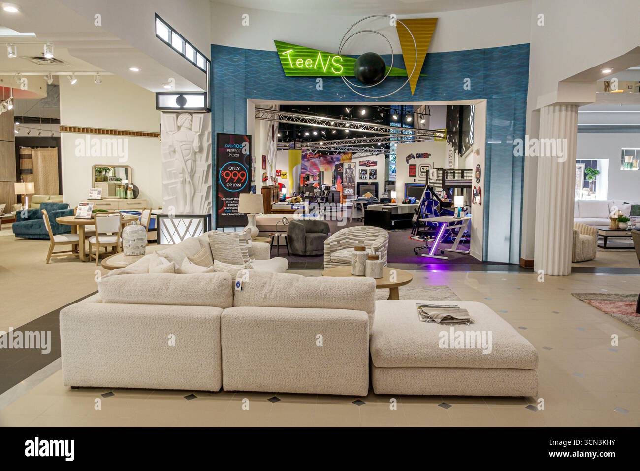 Kendall Miami Florida,Rooms to Go,furniture store business,inside interior,display sale staging,teen furniture department entrance,neon Teens sign,gam Stock Photo