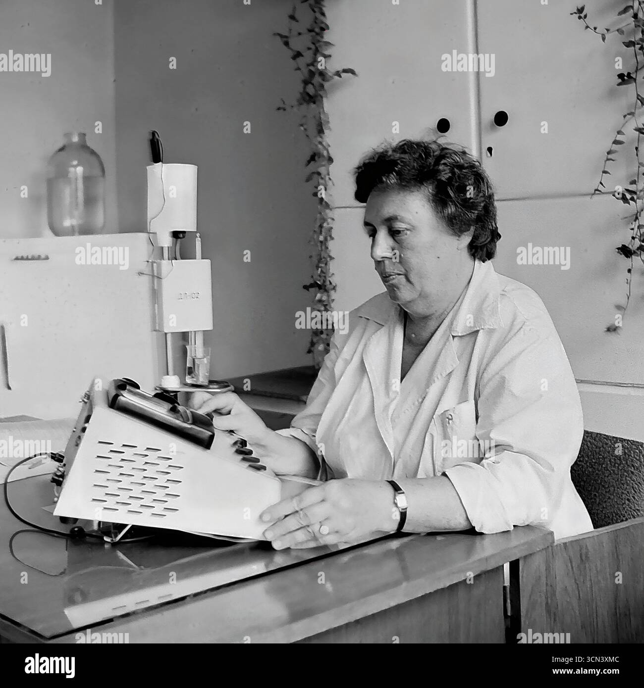 Soviet Testing Lab A historical photograph from the 1970-80s, capturing a female lab ...