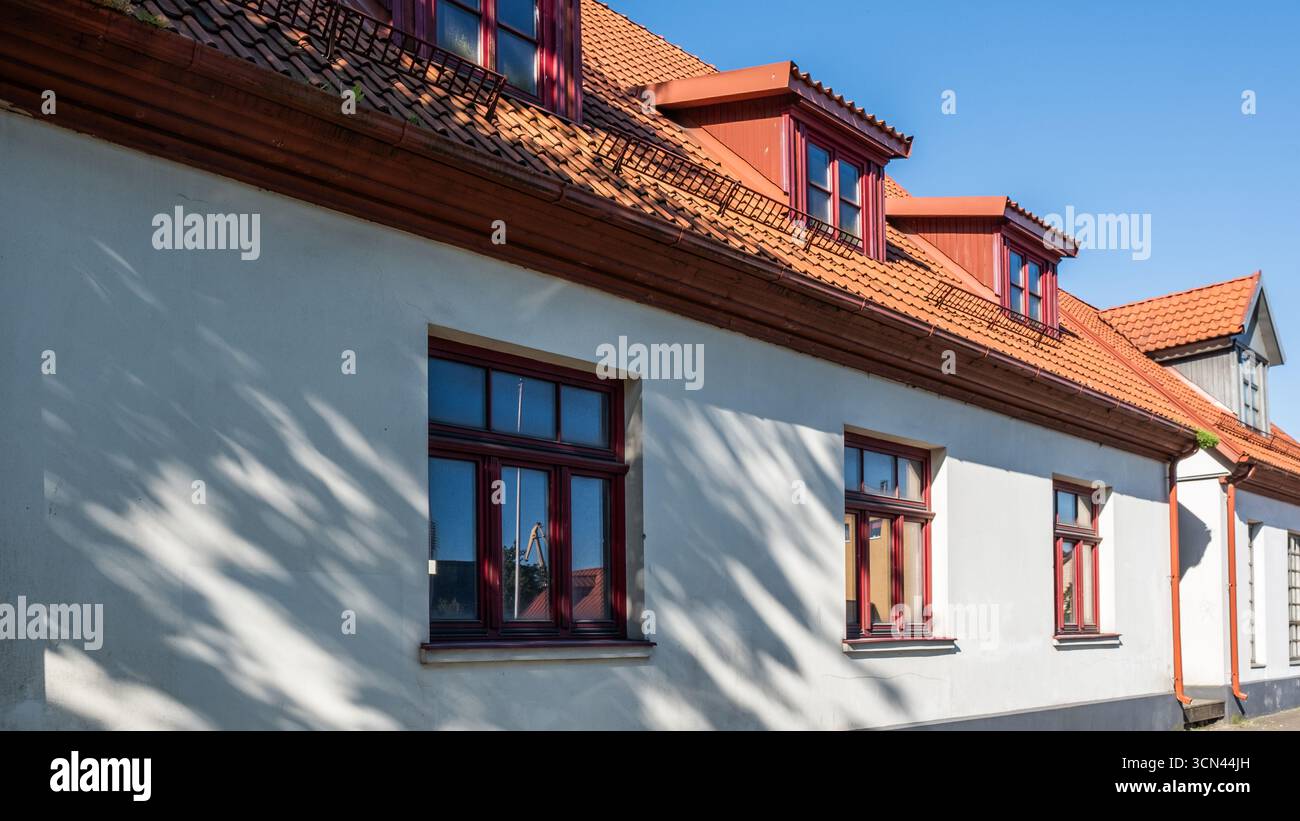Traditional building features terracotta roofing tiles, emphasizing ...