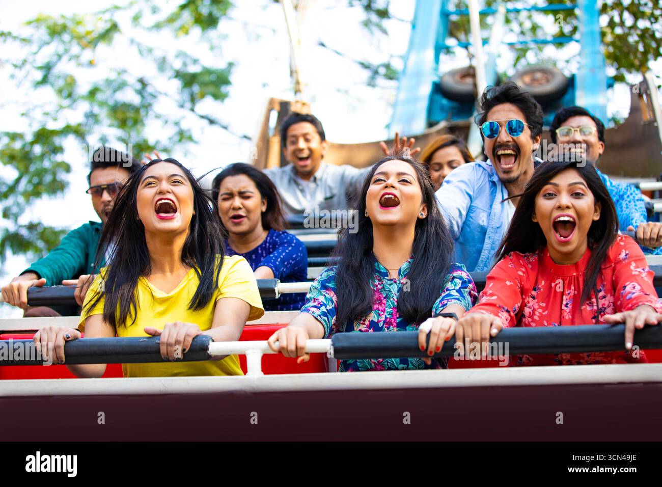 Friends Thrilled on Roller Coaster Ride - Exciting Amusement Park ...