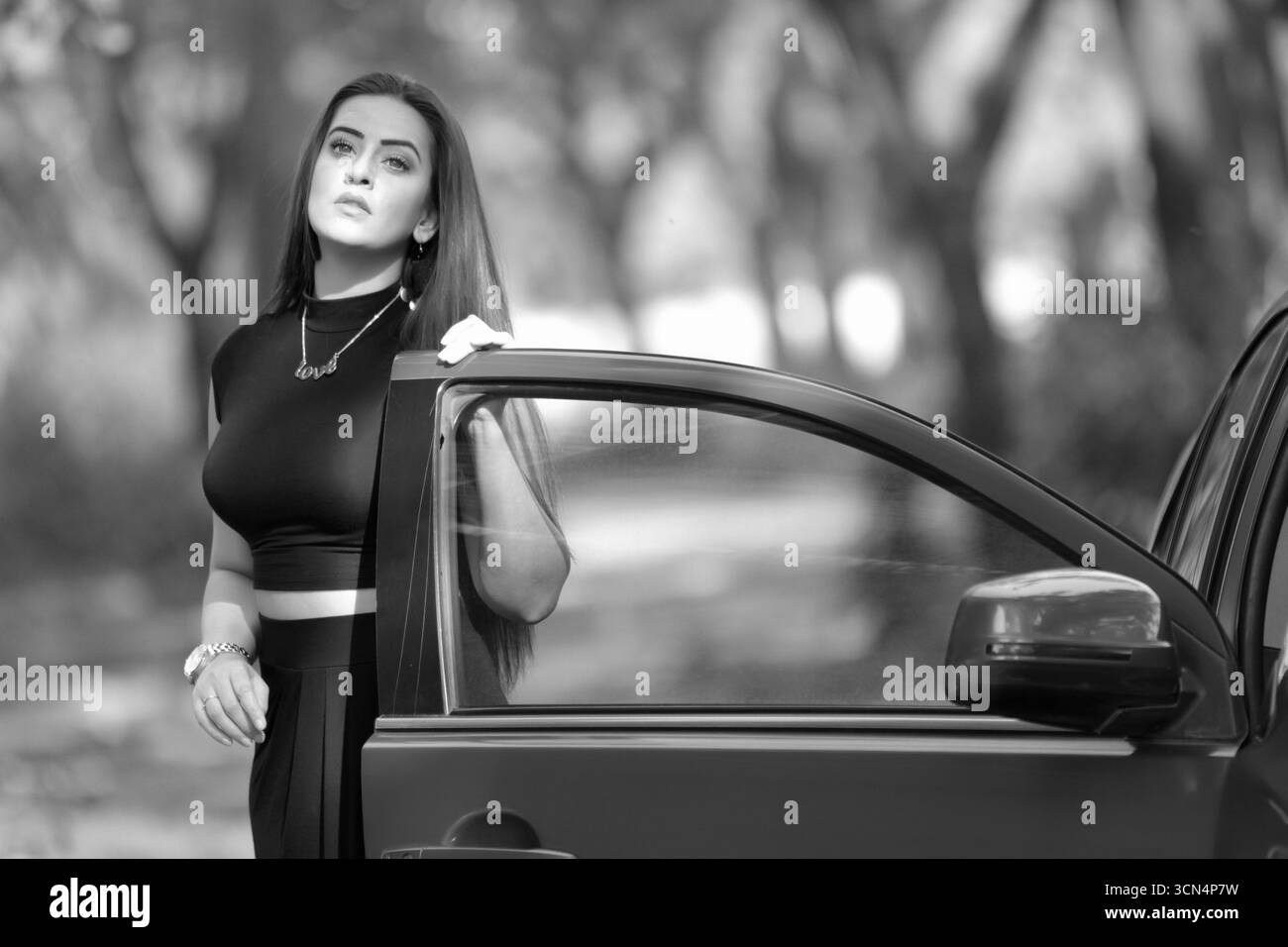 Long cool woman in a black dress hi-res stock photography and images - Alamy