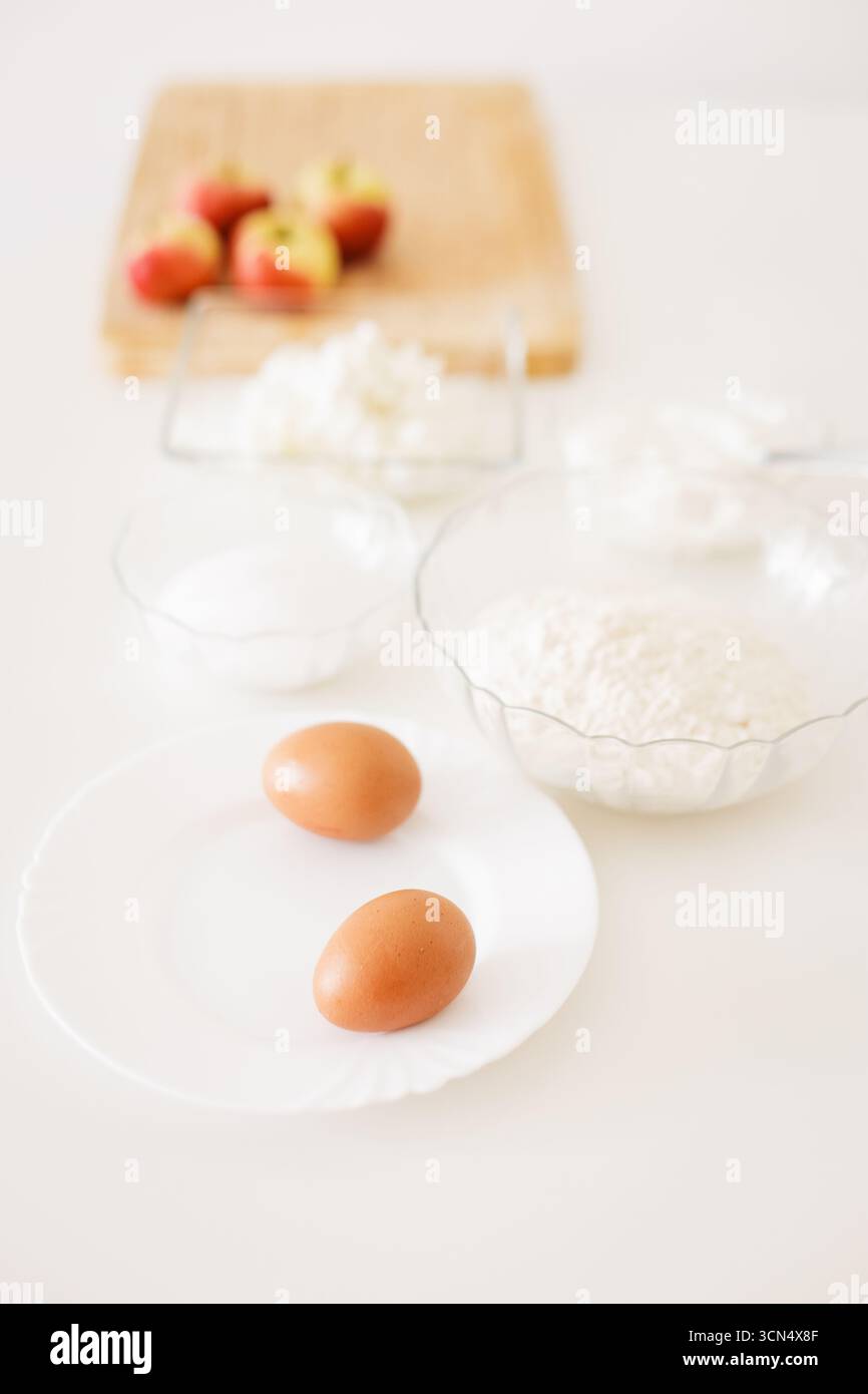 Preparing ingredients for baking apple pie on white table Stock Photo