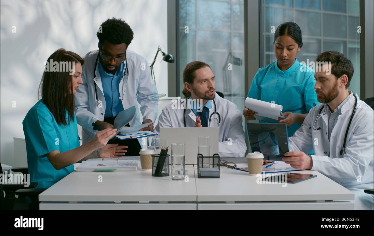 Group multiethnic doctors thinking discussion hi-res stock photography ...