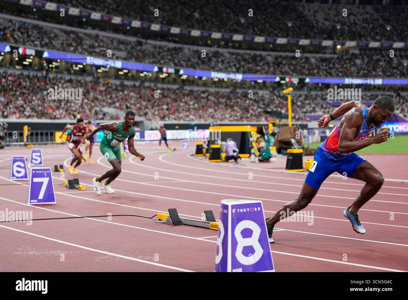 United States' Rai Benjamin, right, races to compete in the men's 400 ...