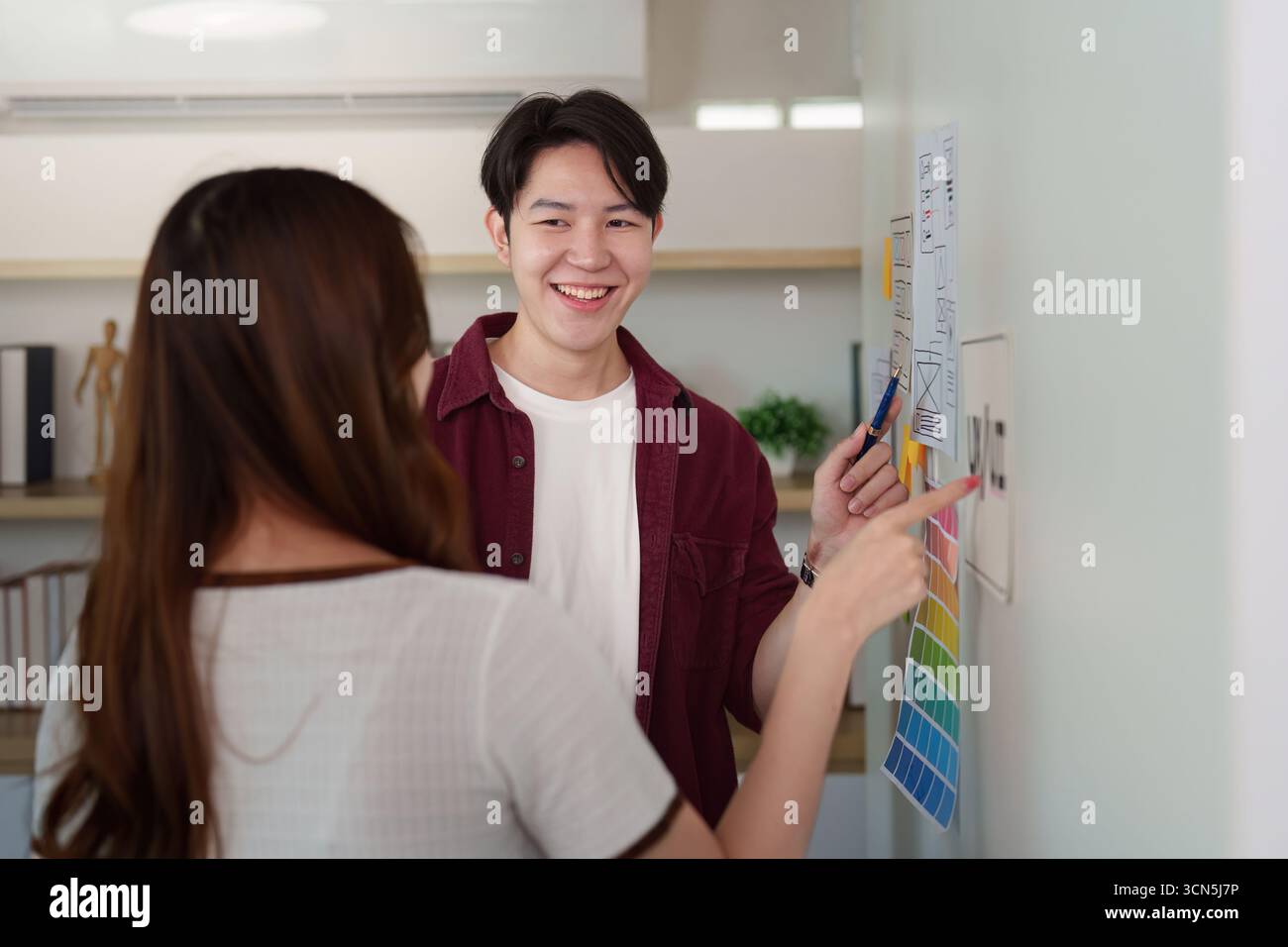 Creative Team Discussing UX UI Design Concepts Stock Photo