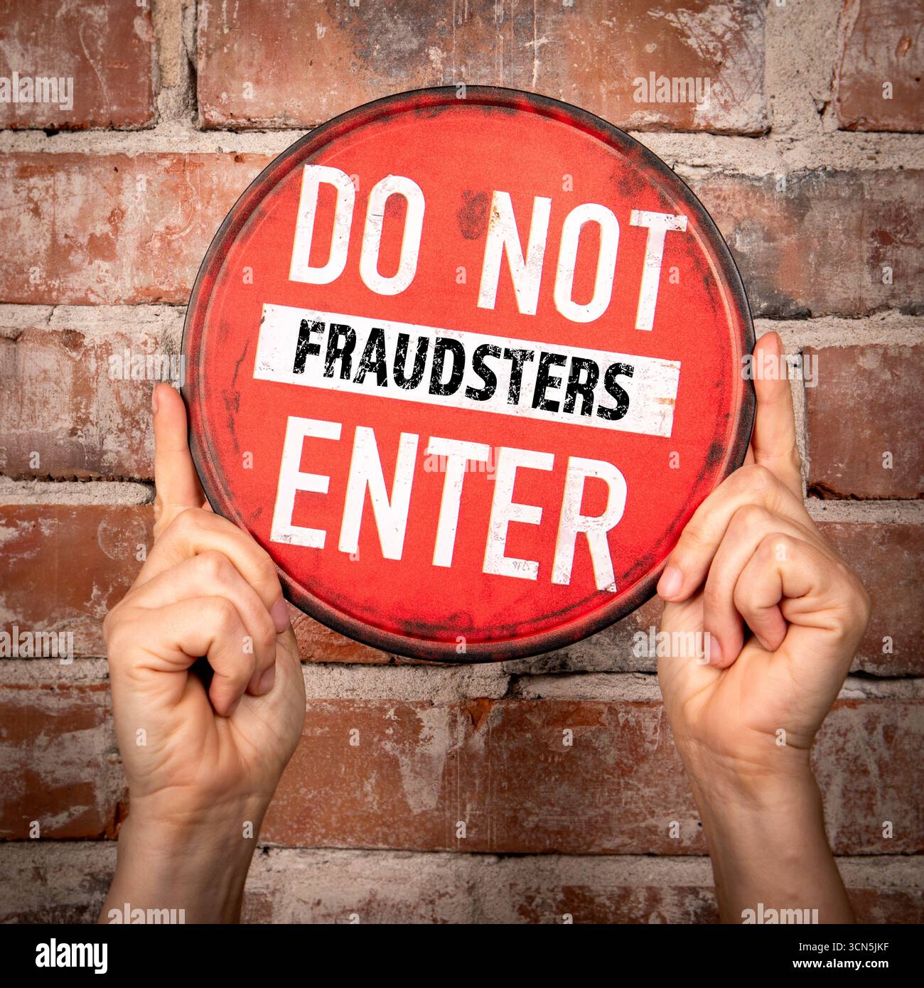 Hands holding red do not enter fraudsters sign Stock Photo - Alamy