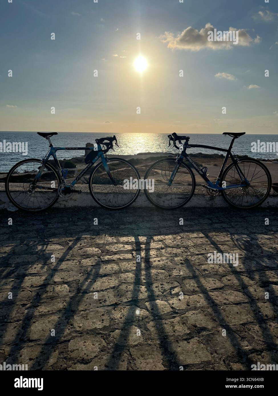 “Bicycles parked near the historic Borj Ras fortress in Mahdia, Tunisia, Mediterranean coast” - Smartphone Captured Stock Image