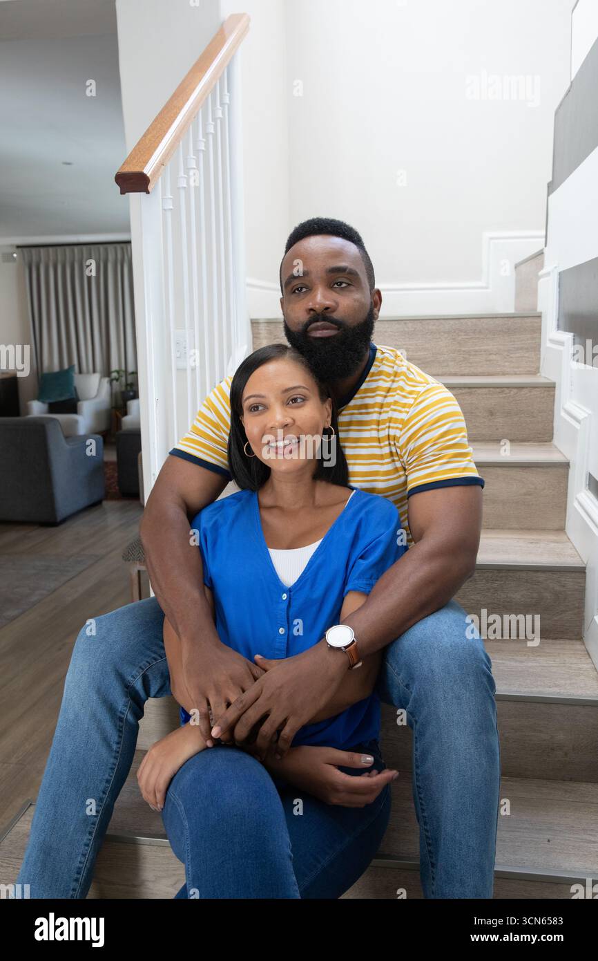 African american couple wrapping arms hi-res stock photography and ...