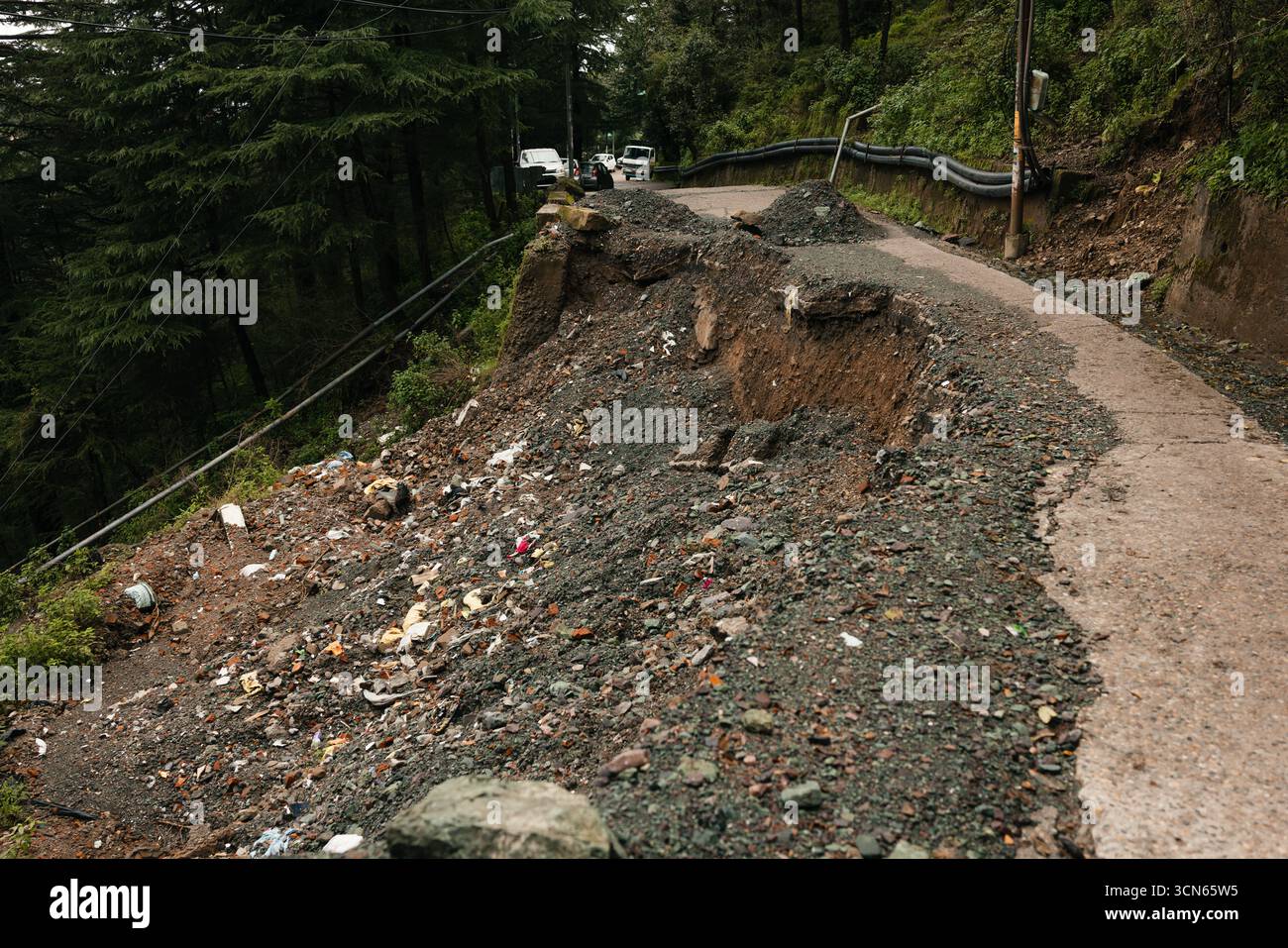 Landslide on mountain road after heavy rain disaster Stock Photo - Alamy