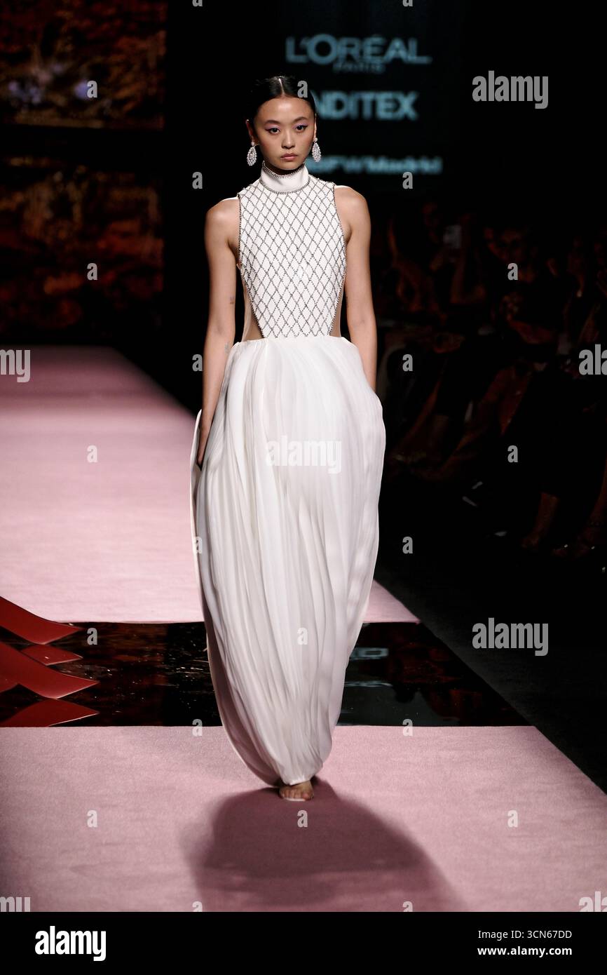 Madrid, Spain. 19th Sep, 2025. A model walks the runway in a Spring ...