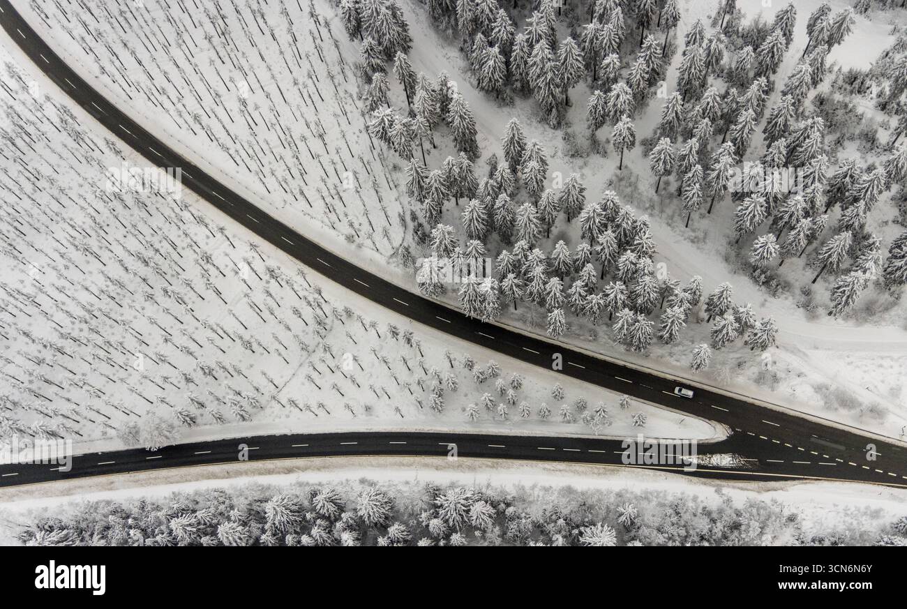 Aerial View Of The Snowy Winter Landscape Of Winterberg With Winding aerial-view-of-the-snowy-winter-landscape-of-winterberg-with-winding