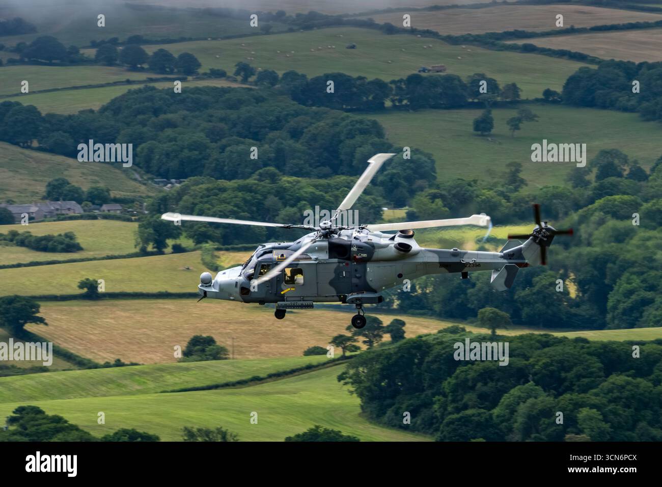 British Army AgustaWestland AW159 Wildcat AH1 helicopter ZZ398 low over ...