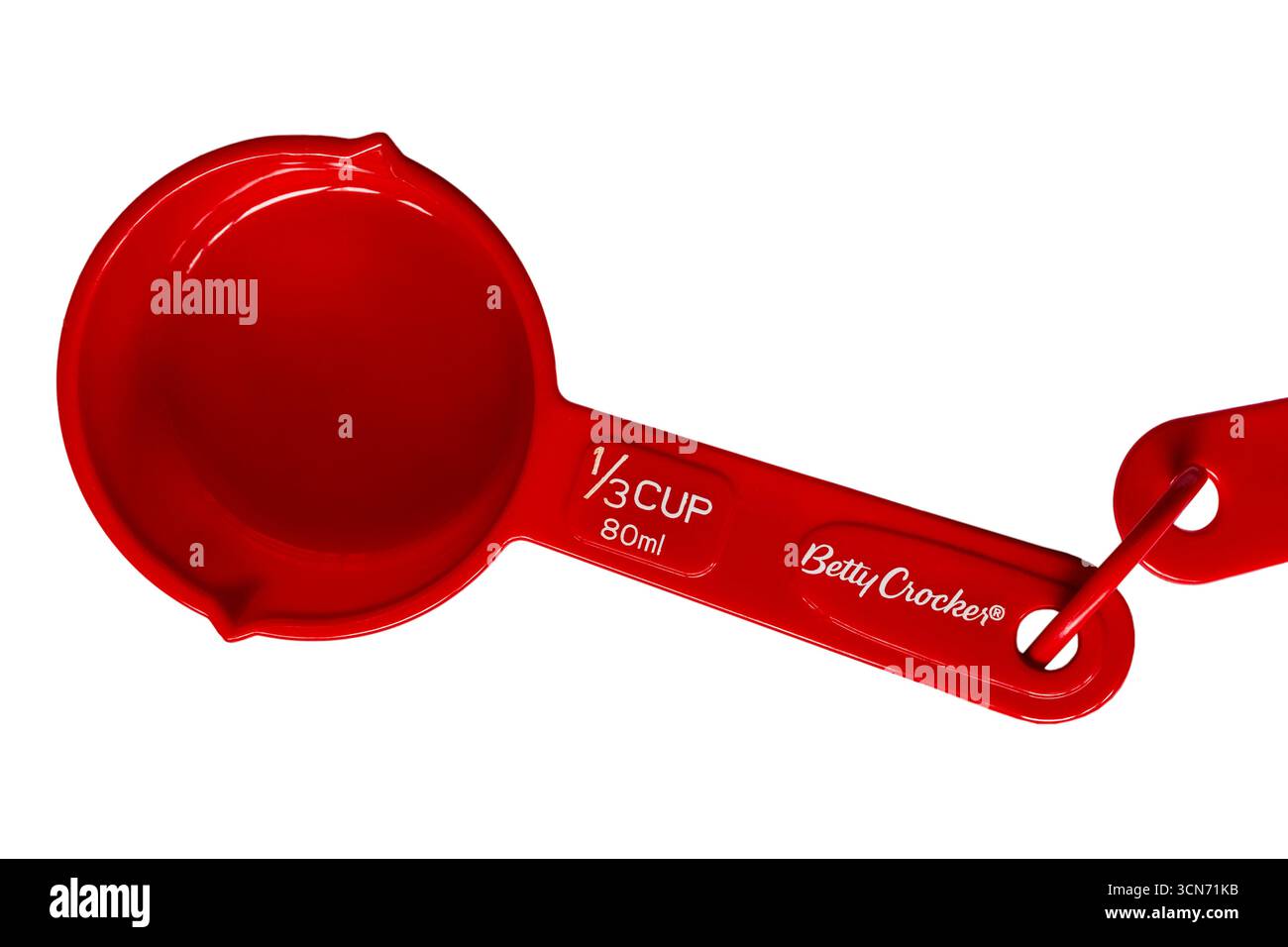 red Betty Crocker measuring cup size 1/3 cup 80ml set on white background Stock Photo