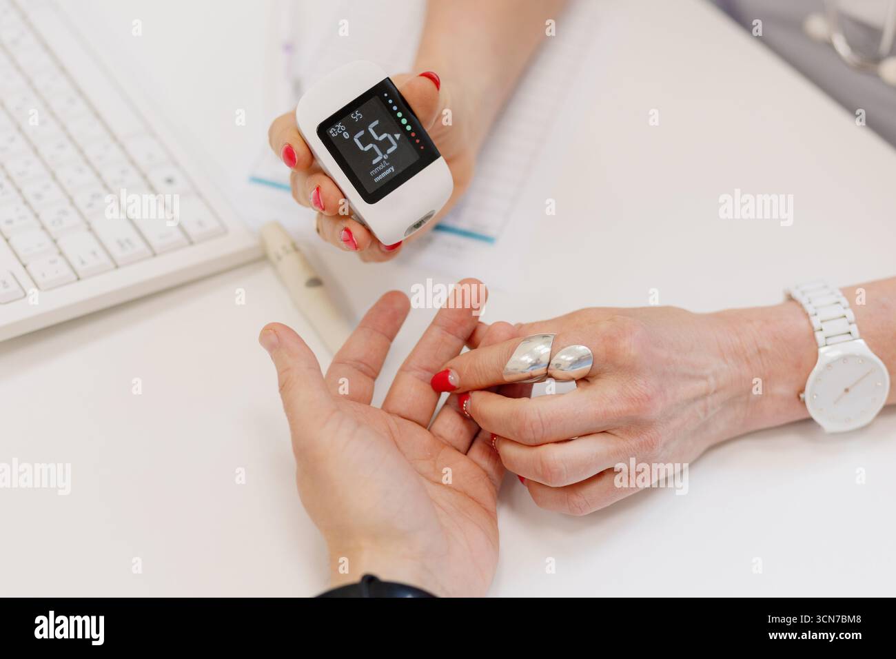 During a consultation, a healthcare professional shows a digital health ...