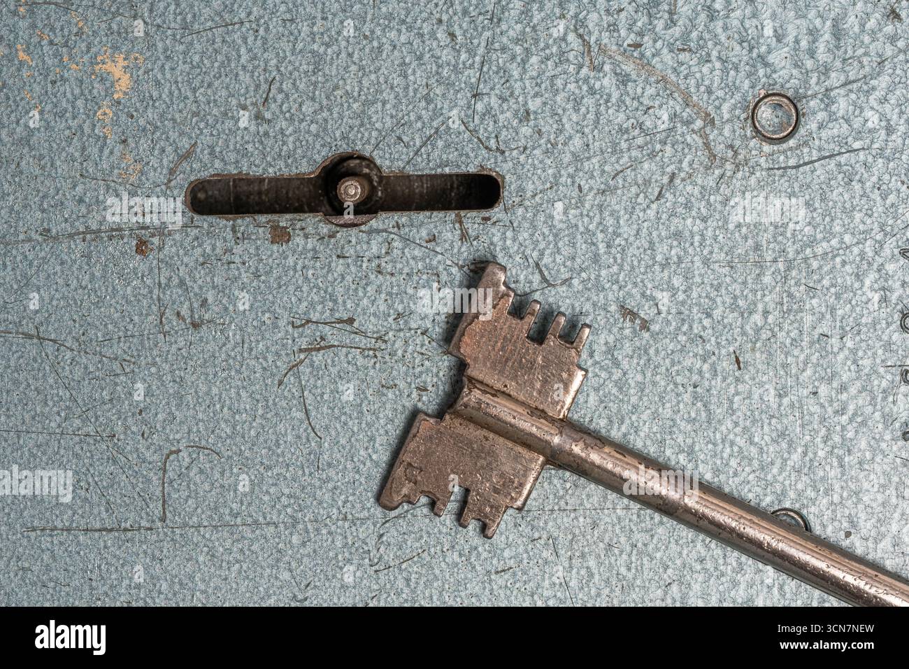 Old rusty key on background old wall. Concept security Stock Photo