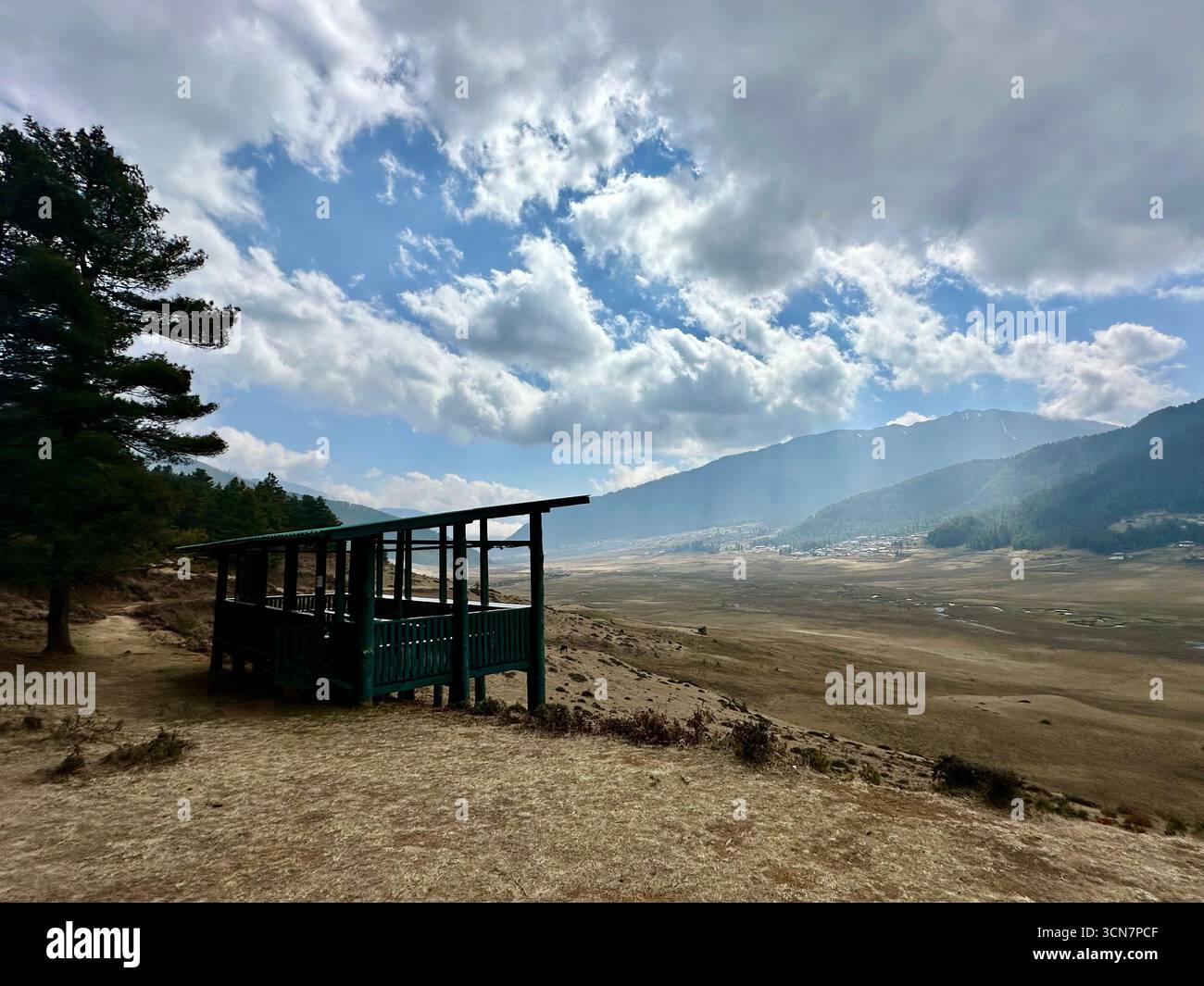 wooden shelter overlooking the vast Phobjika Valley in Bhutan Stock Photo