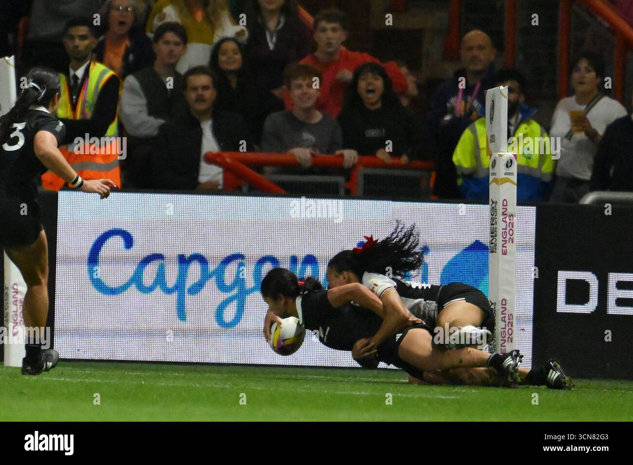 New Zealand's Braxton Sorensen-McGee, bottom, scores a try during the ...