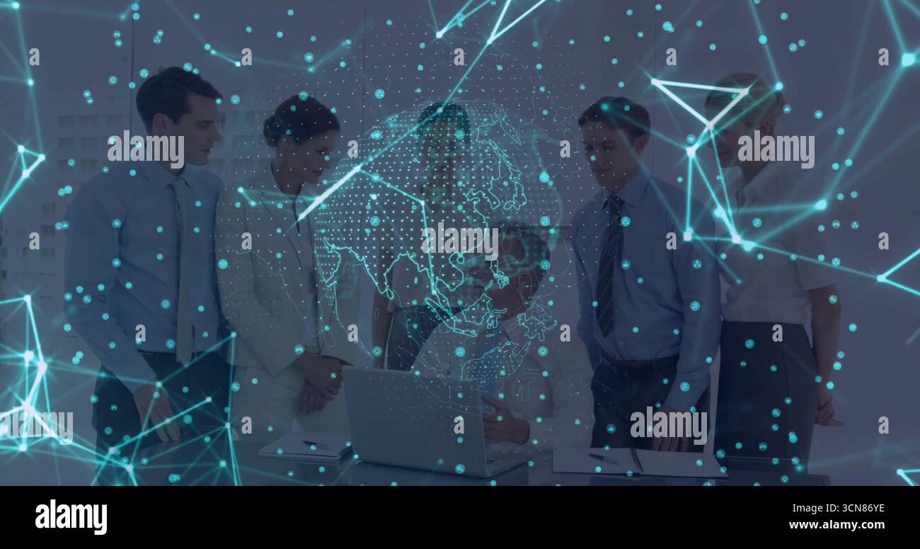 Collaborating professionals analyzing data on laptop in conference room, with network overlay Stock Photo