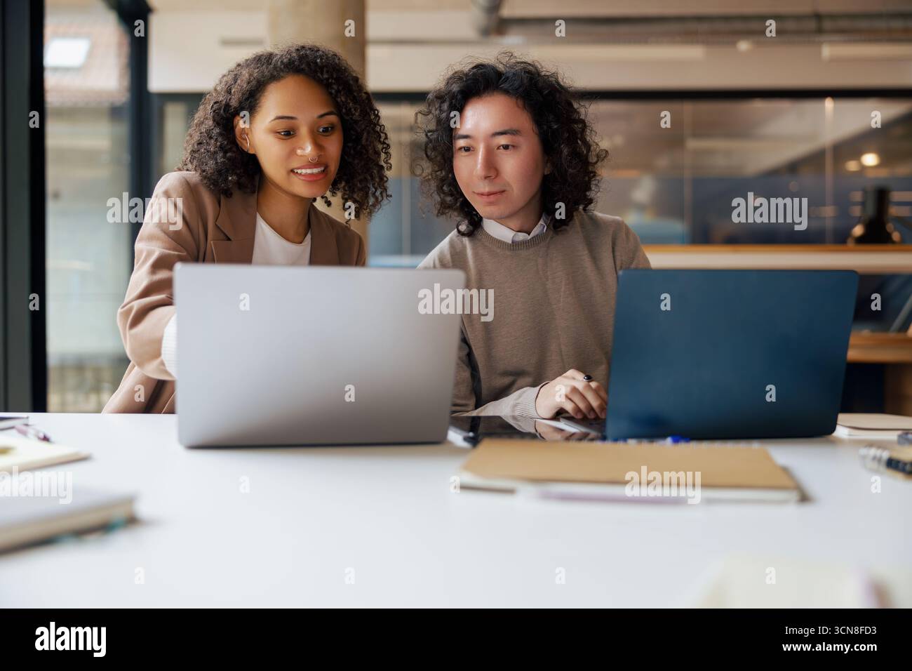 Engaging in a Collaborative Work Session within a Modern Office Environment for success Stock Photo