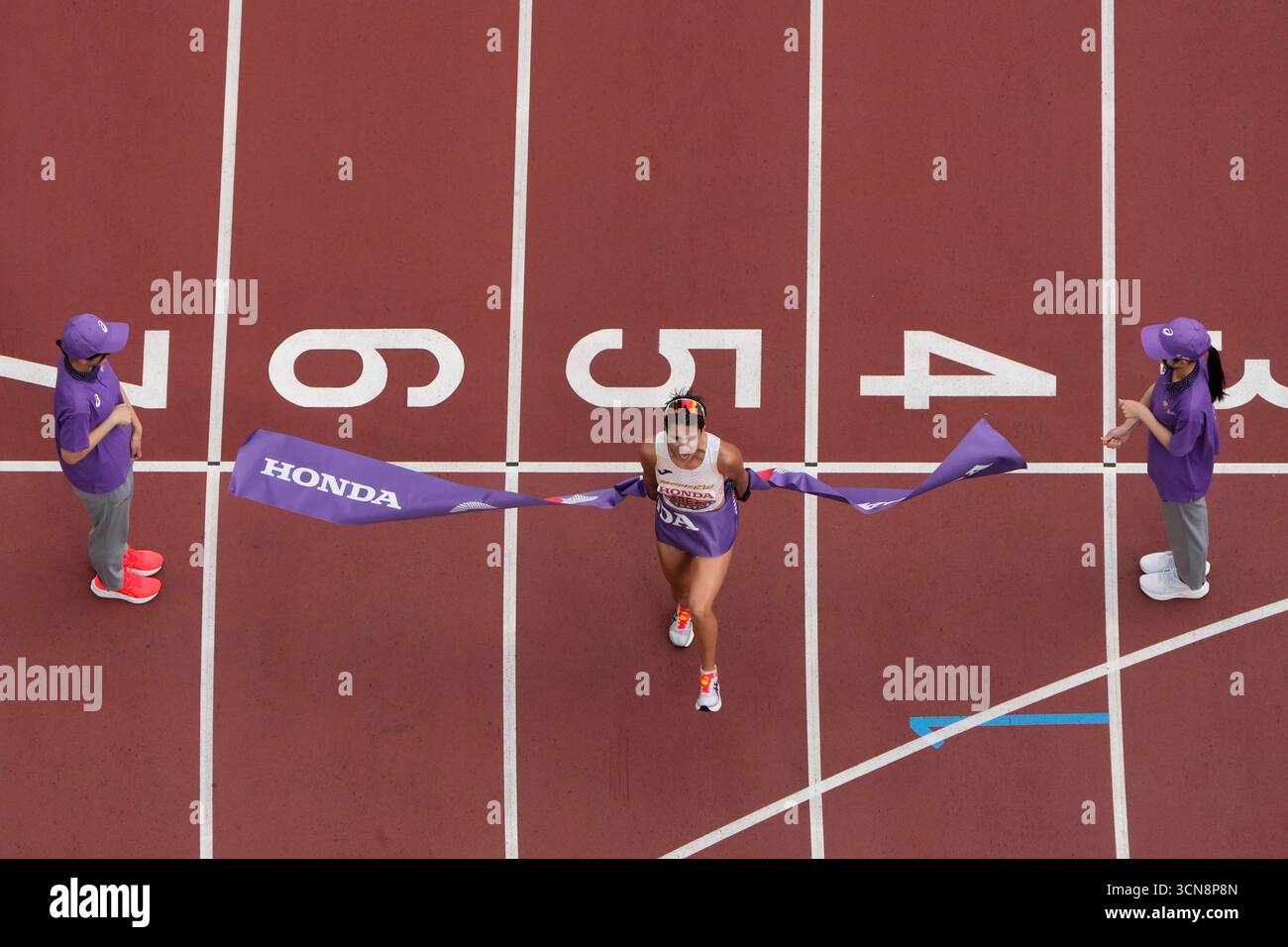 Spain's Maria Perez celebrates as she wins the women's 20 kilometers ...