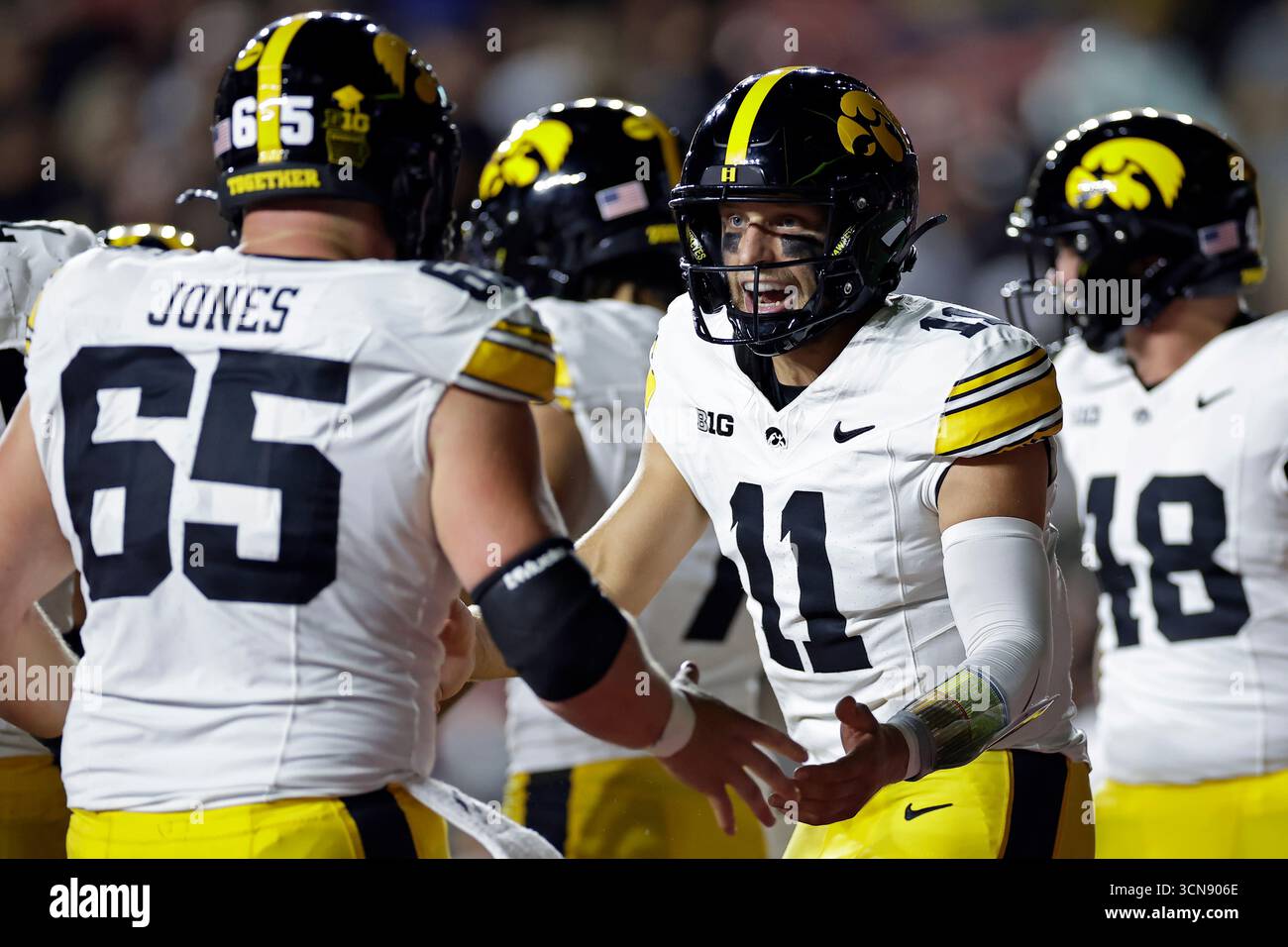 Gronowski Iowa quarterback Mark Gronowski (11) celebrates a touchdown with Logan ...