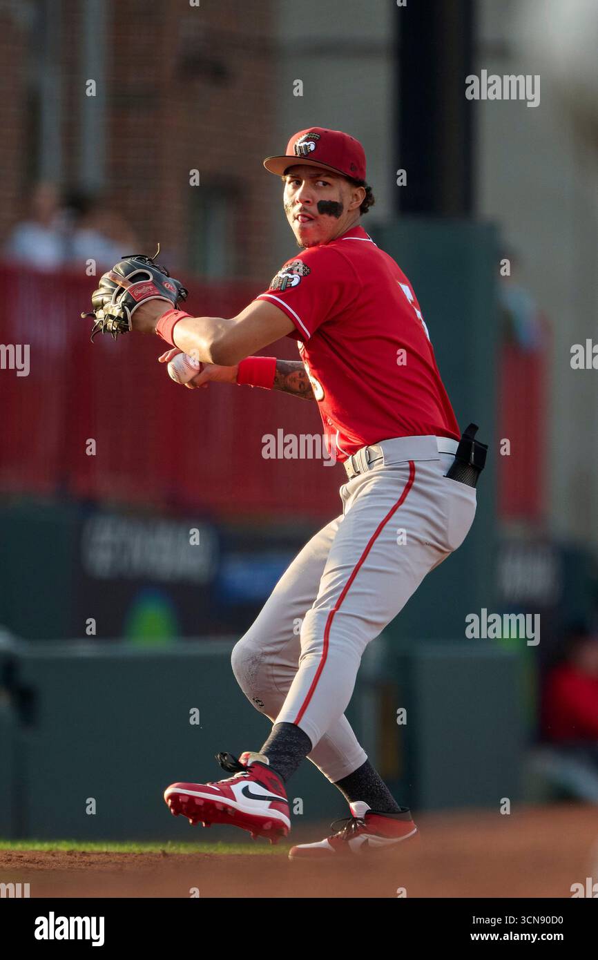 Altoona Curve third baseman Javier Rivas (5) throws to first base ...