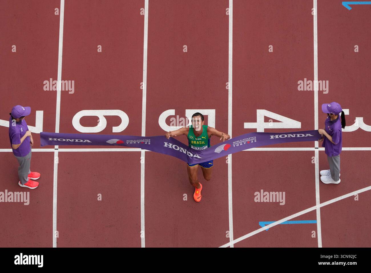Brazil's Caio Bonfim celebrates winning the men's 20 kilometers race ...