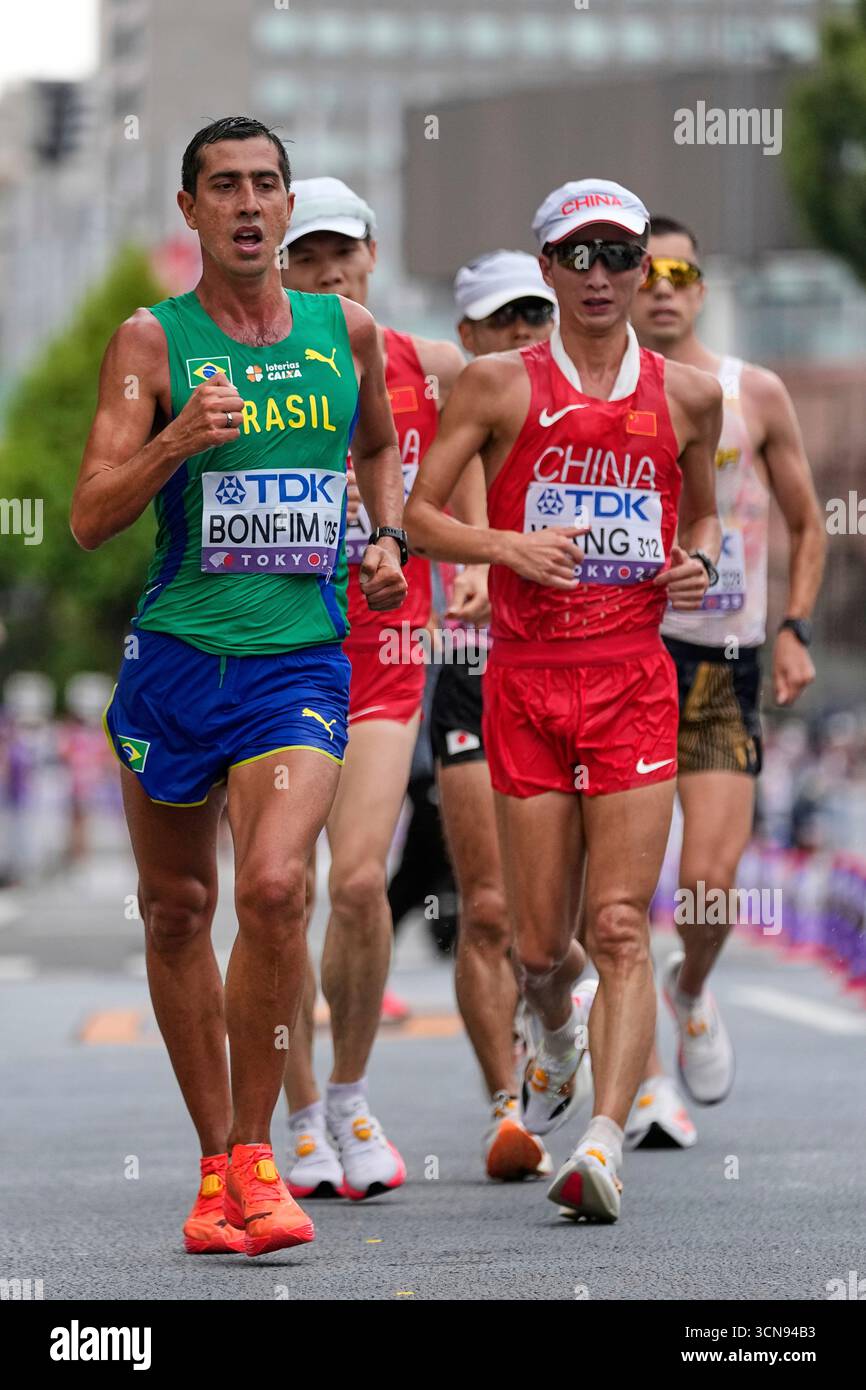 Brazil's Caio Bonfim races alongside China's Wang Zhaozhao on his way ...