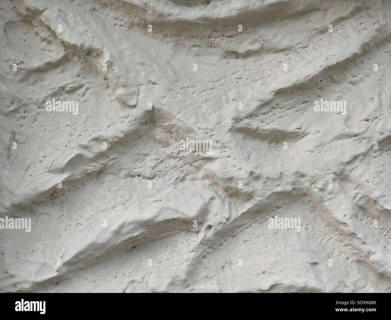 light grey plaster wall useful as a background Stock Photo