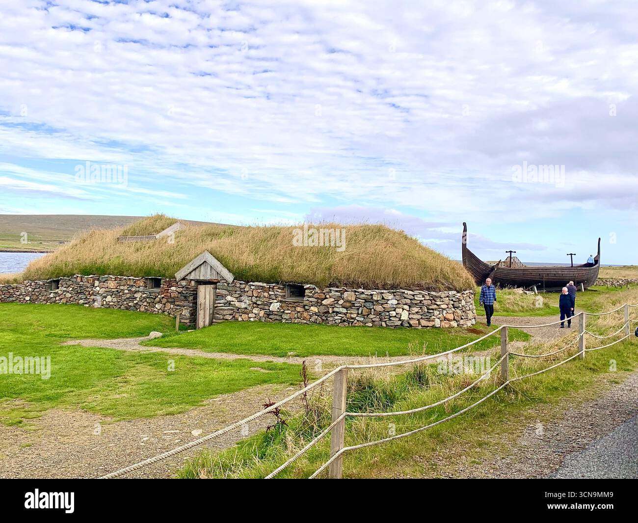 Shetland islands airport runway plane landing Lerwick  tail road hills road sign lamb sheep water sea heather shore mountains mountain Viking ship - Smartphone Captured Stock Image