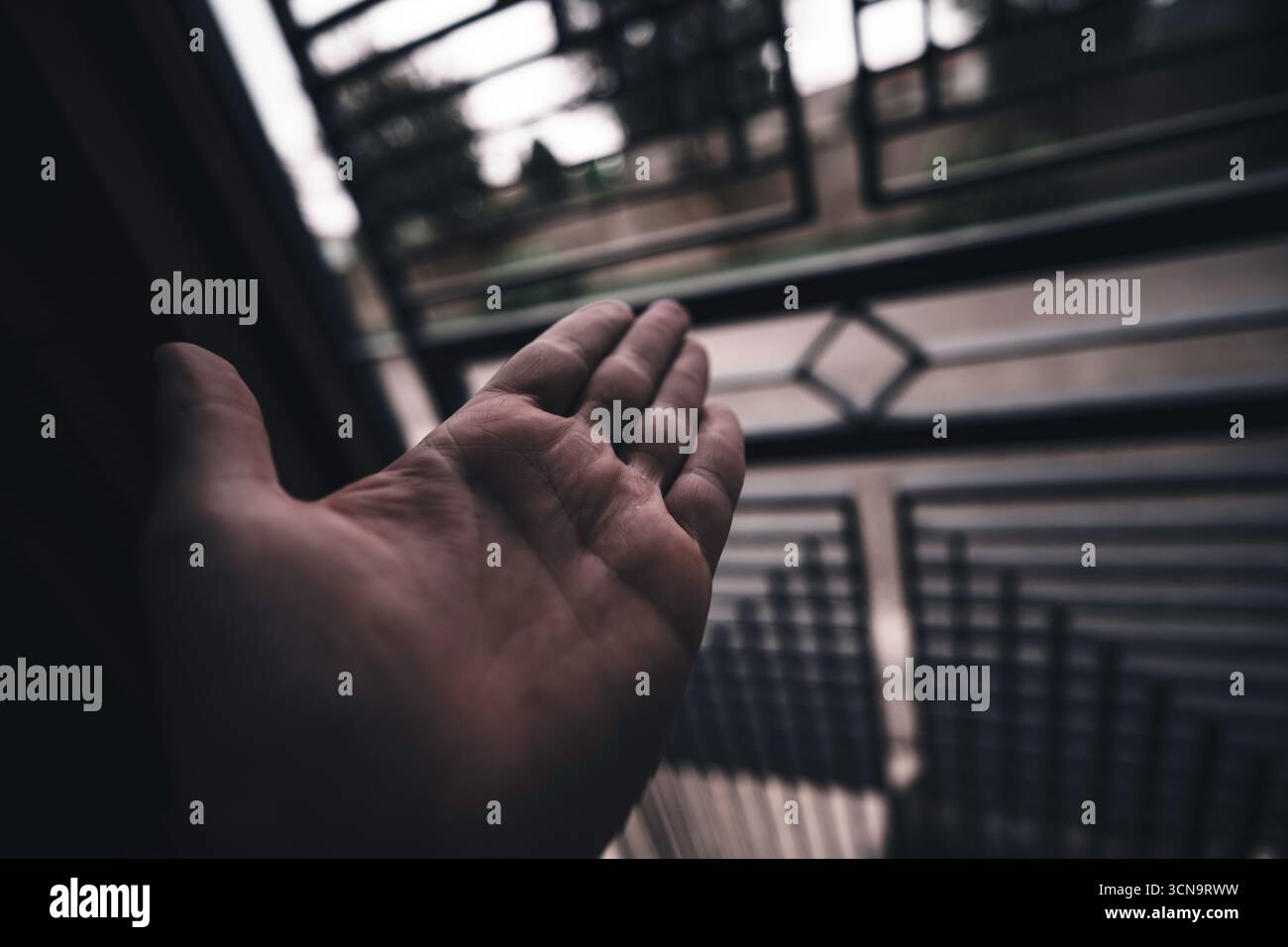 Open hand reaches through hi-res stock photography and images - Alamy