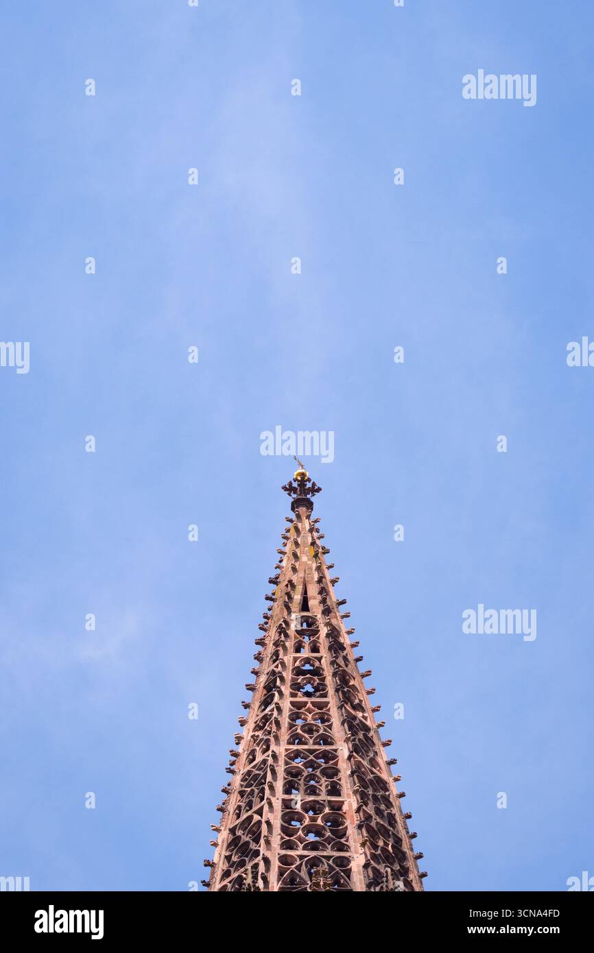 Freiburg Minster / Freiburger Münster, top of the spire against a blue sky, medieval Gothic architecture detail. Stock Photo