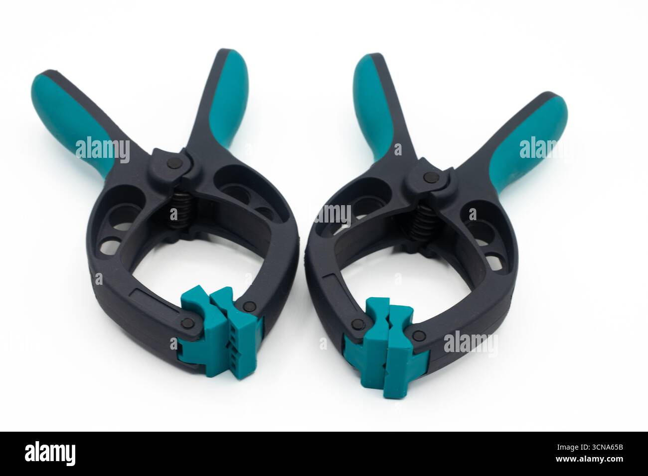 Two plastic clamps on a white background Stock Photo