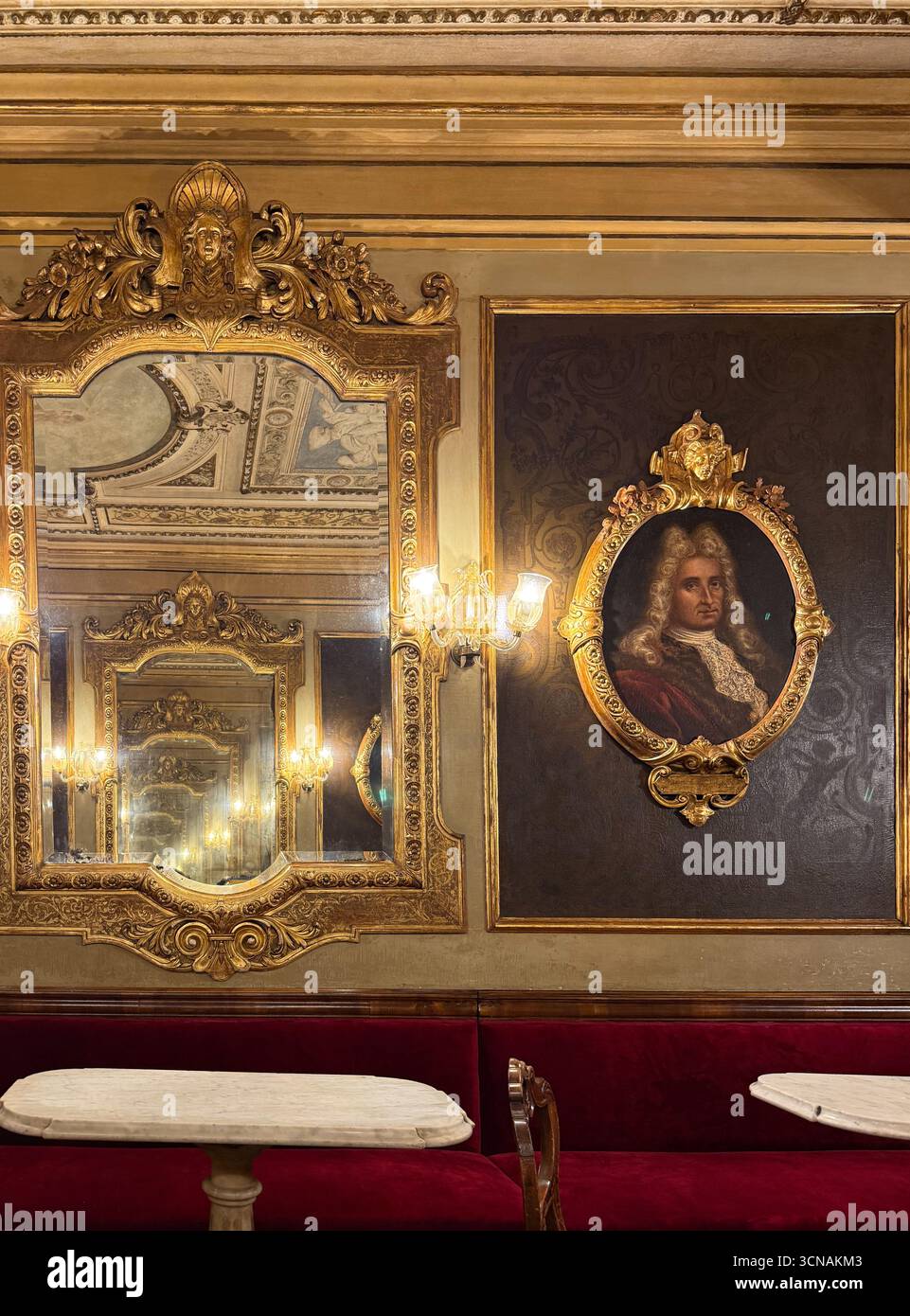 Inside of the historic Caffè Florian in St Mark's Square, with a game of mirrors in the Hall of Illustrious Men, Venice, Veneto, Italy - Smartphone Captured Stock Image