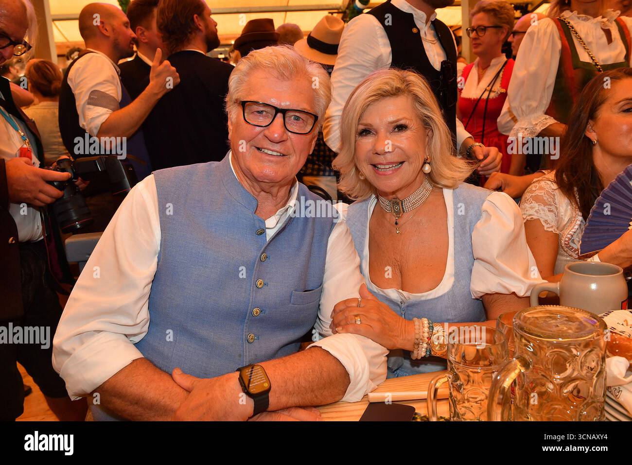 Michael Hartl and Marianne Hartl pose during the opening of the Oktoberfest 2025 at Schottenhamel tent on September 20, 2025 in Munich, Germany. Stock Photo
