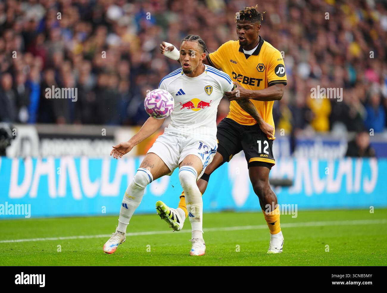 Leeds United's Noah Okafor (left) and Wolverhampton Wanderers' Emmanuel ...