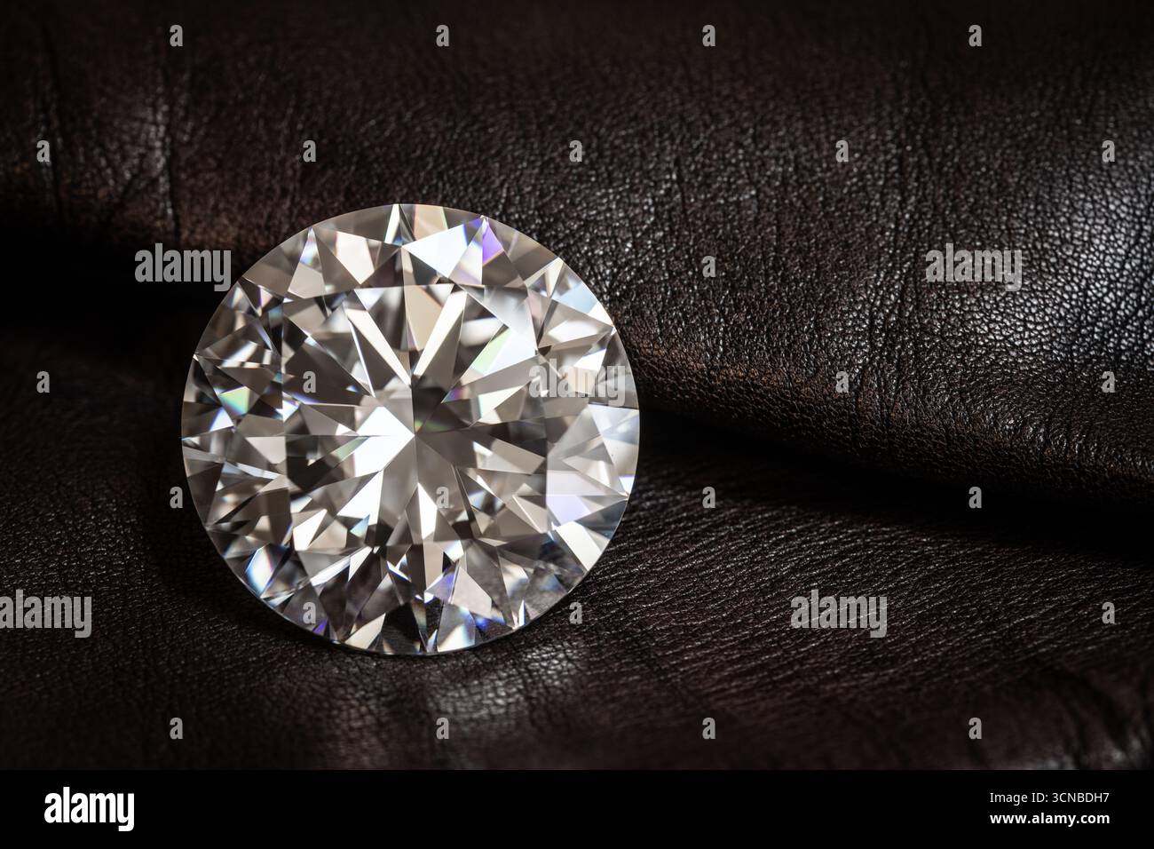 Big Carat Diamond Gemstone on Brown Leather Stock Photo