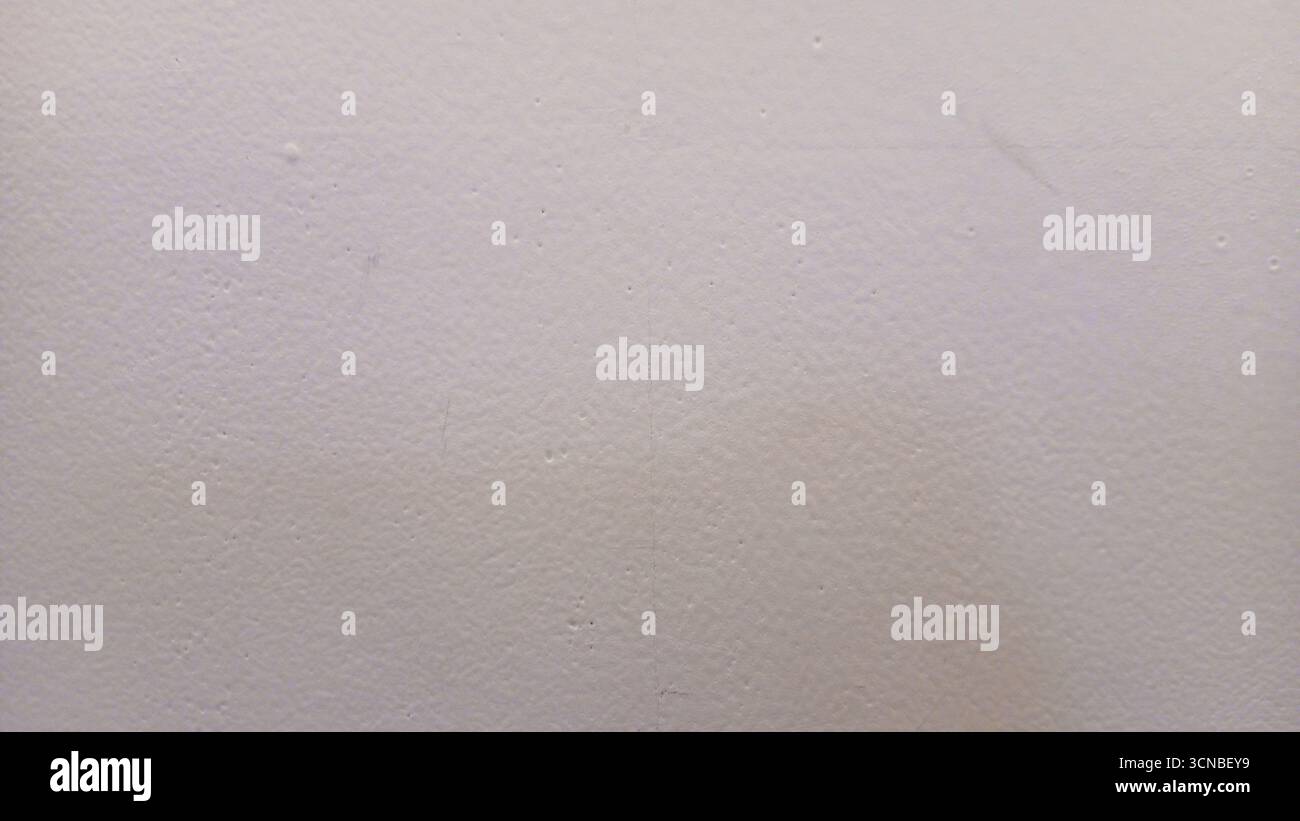 Textured white wall background with subtle imperfections Stock Photo